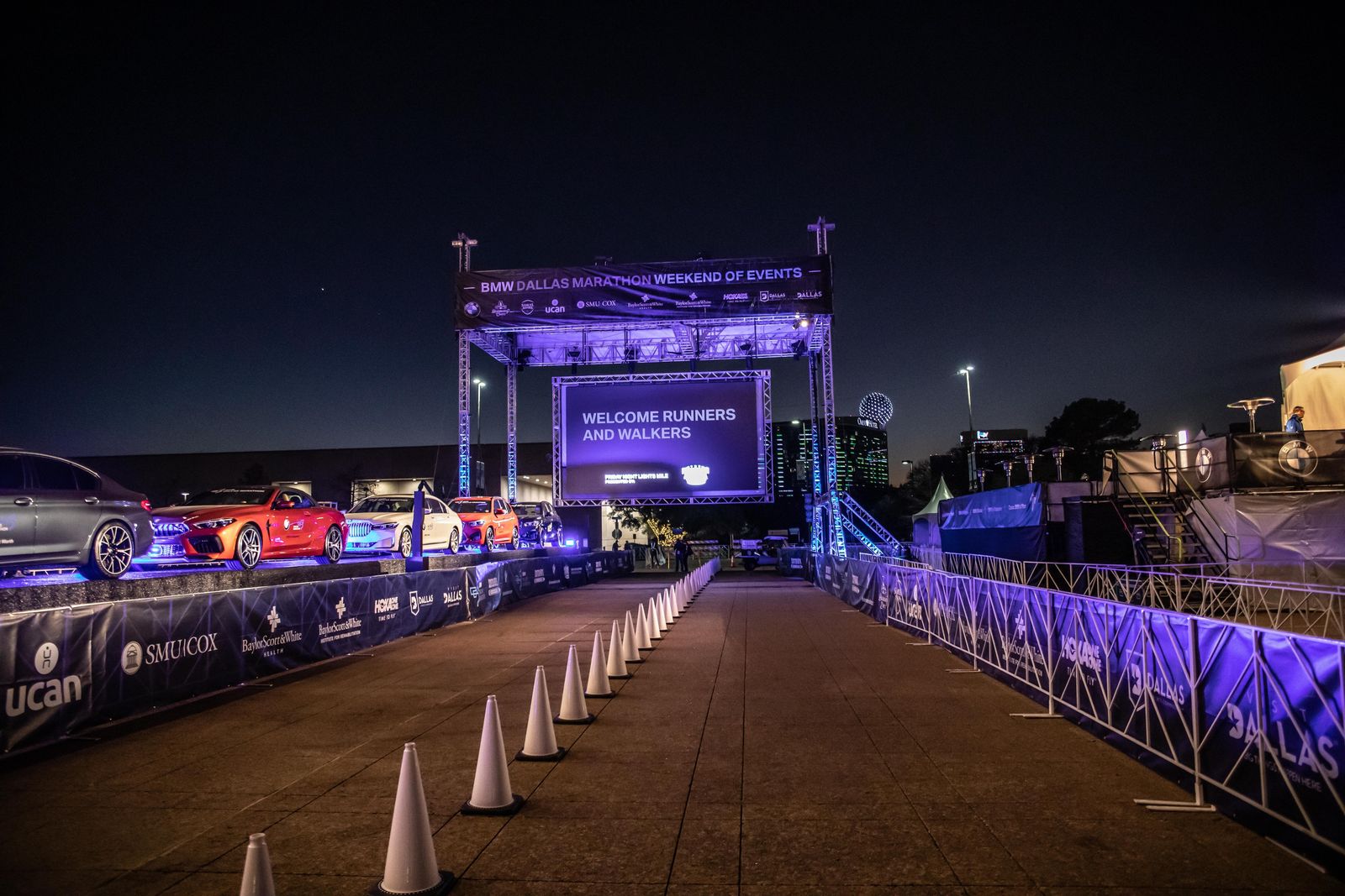 The BMW Dallas Marathon stage and purple professional lighting creates an aura of intensity, ideal for successful sports event production
